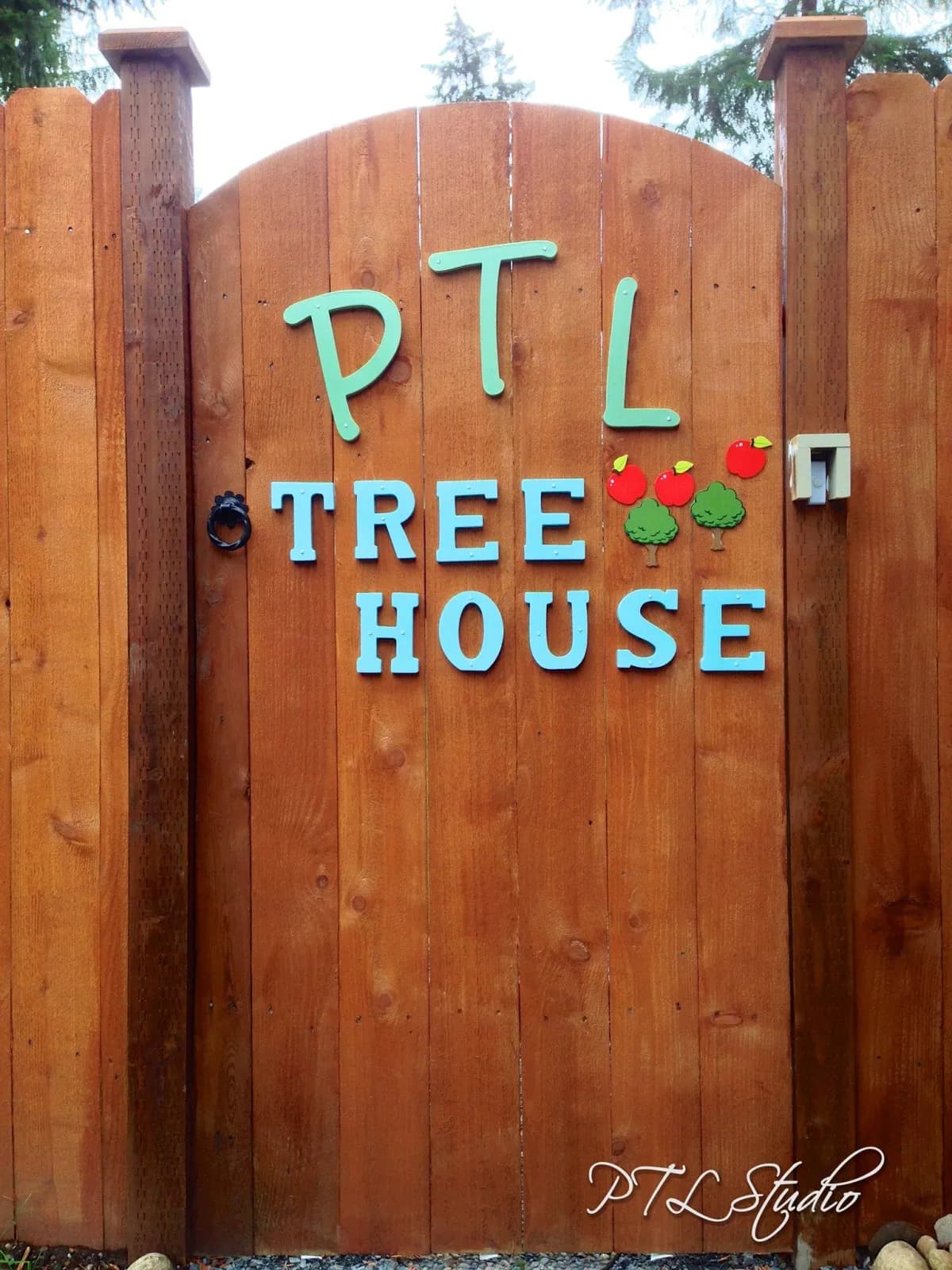 The PTL Treehouse garden gate with the school's hand-painted sign